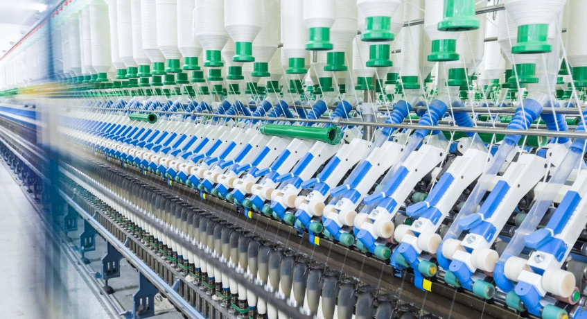 Otomatisasi pabrik manufaktur tekstil dengan ERP.